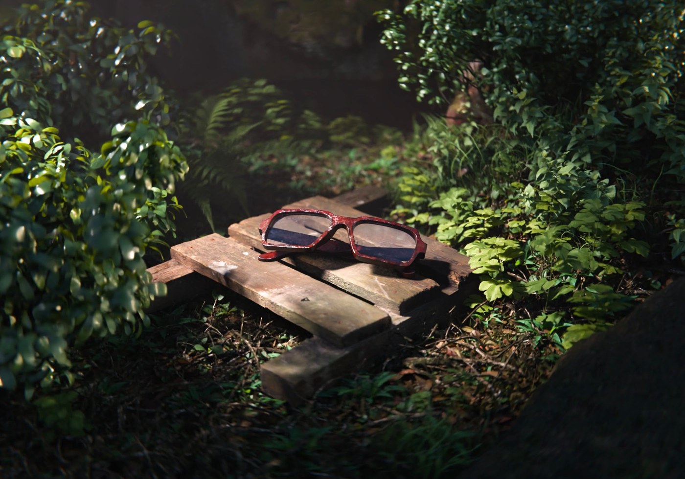 Red glasses resting on a wooden pallet among green foliage, test render by wavelength3d